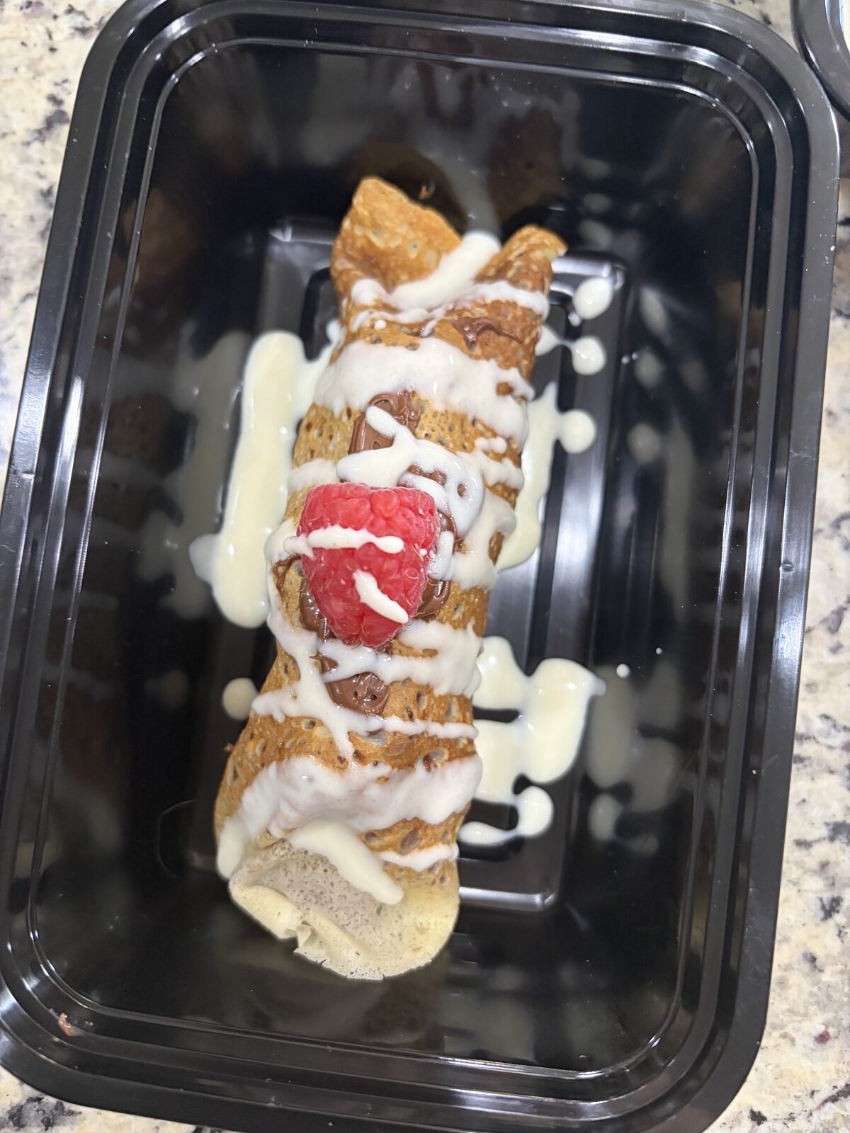 Fresh fruit crepes finished with vanilla cream sauce